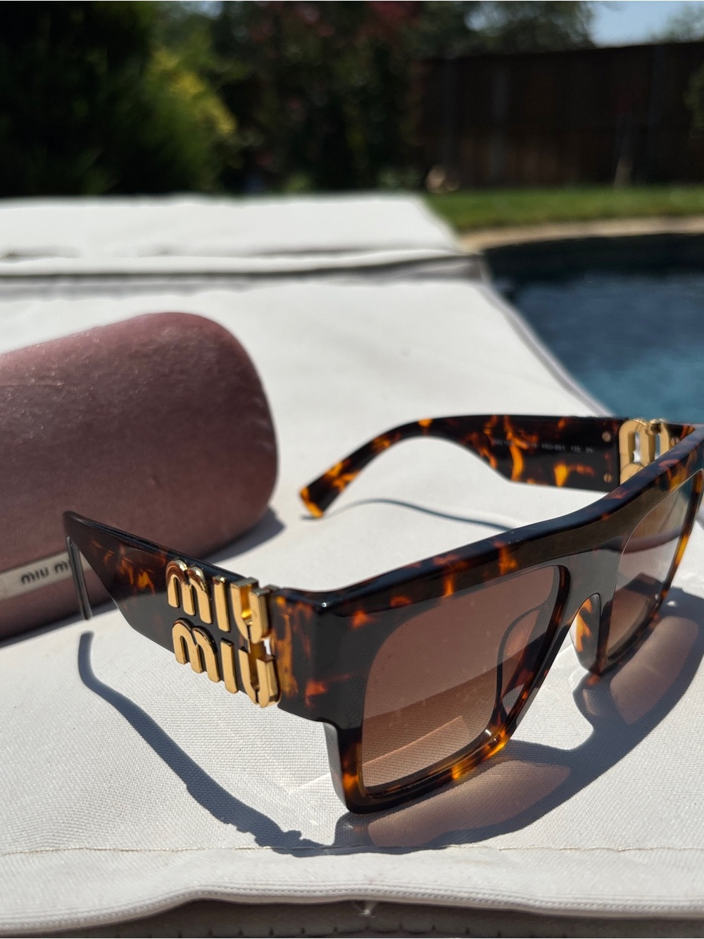 Miu Miu Tortoiseshell Sunglasses with Gold Accents